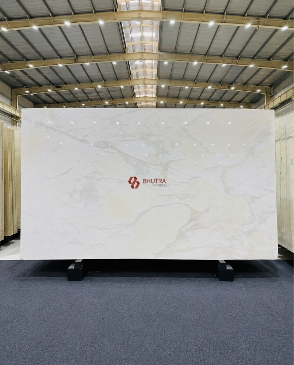 Calacatta Gold marble close up slab with warm golden veining, polished finish