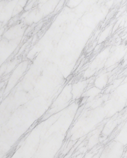 Close-up texture of Carrara White Marble showcasing subtle grey veining on a white base – premium Italian marble for interiors
