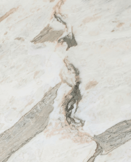 Michelangelo Marble slab close-up with soft white base, beige undertones and bold grey natural veining