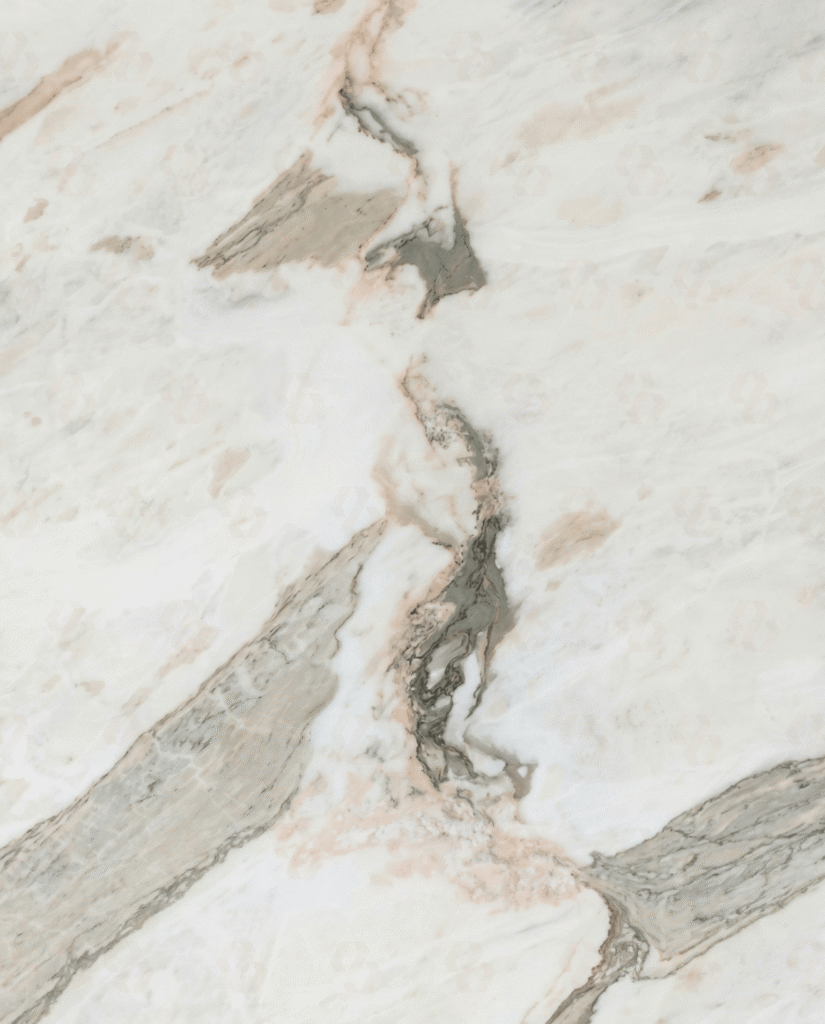 Michelangelo Marble slab close-up with soft white base, beige undertones and bold grey natural veining