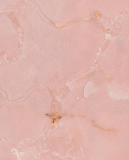 Close-up of Pink Onyx Marble texture with soft pink translucent tones and natural layered onyx pattern