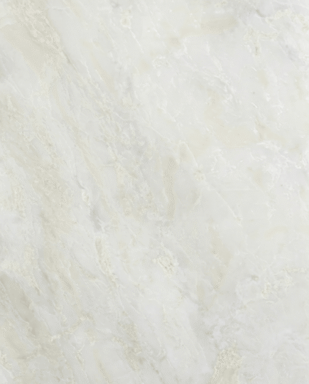 Close-up of white onyx marble slab showing natural translucent texture and soft vein pattern